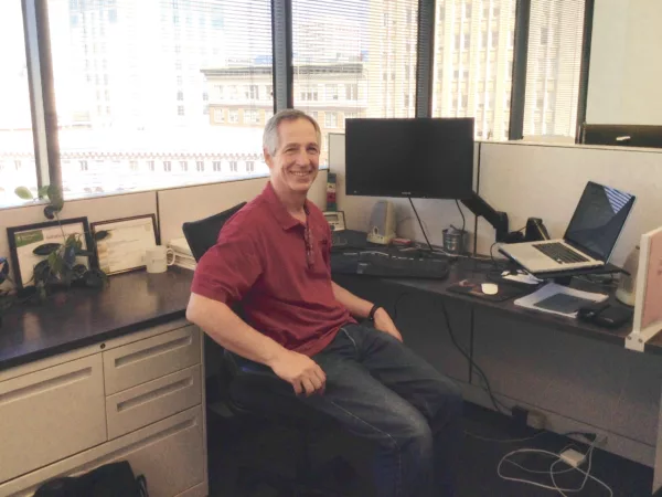 Berrett Koehler Publishers CEO and CFO David Marshall sitting at his desk